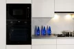 Kluge beépíthető mikrohullámú sütő grillel, 25L, fekete üveg